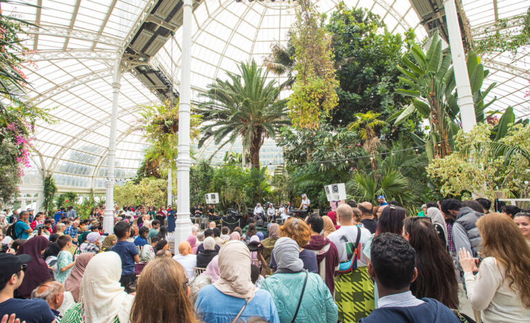 A crowd gathered at the Liverpool Arab Arts Festival in the Sefton Park Palmhouse in Liverpool.