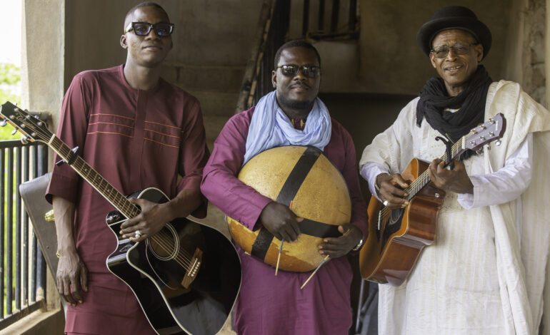 Afel Bocoum and his bandmates posing with their instruments