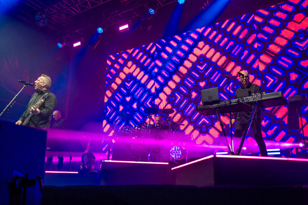 OMD performing live at Rochdale Town Hall Square in 2026